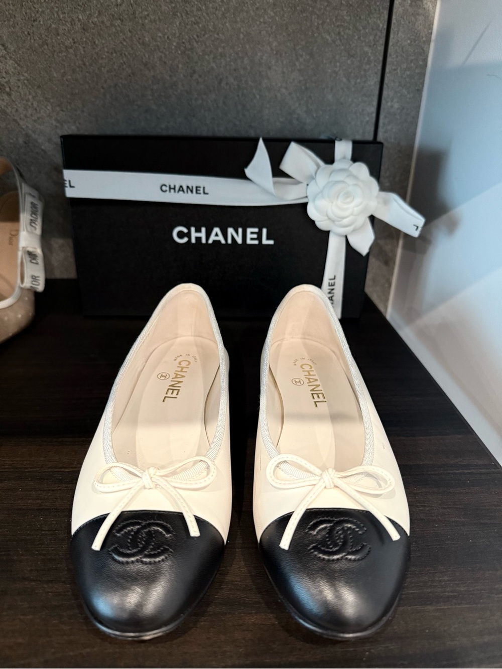CHANEL Two-Tone Leather Cap-Toe Ballet Flats in White and Black